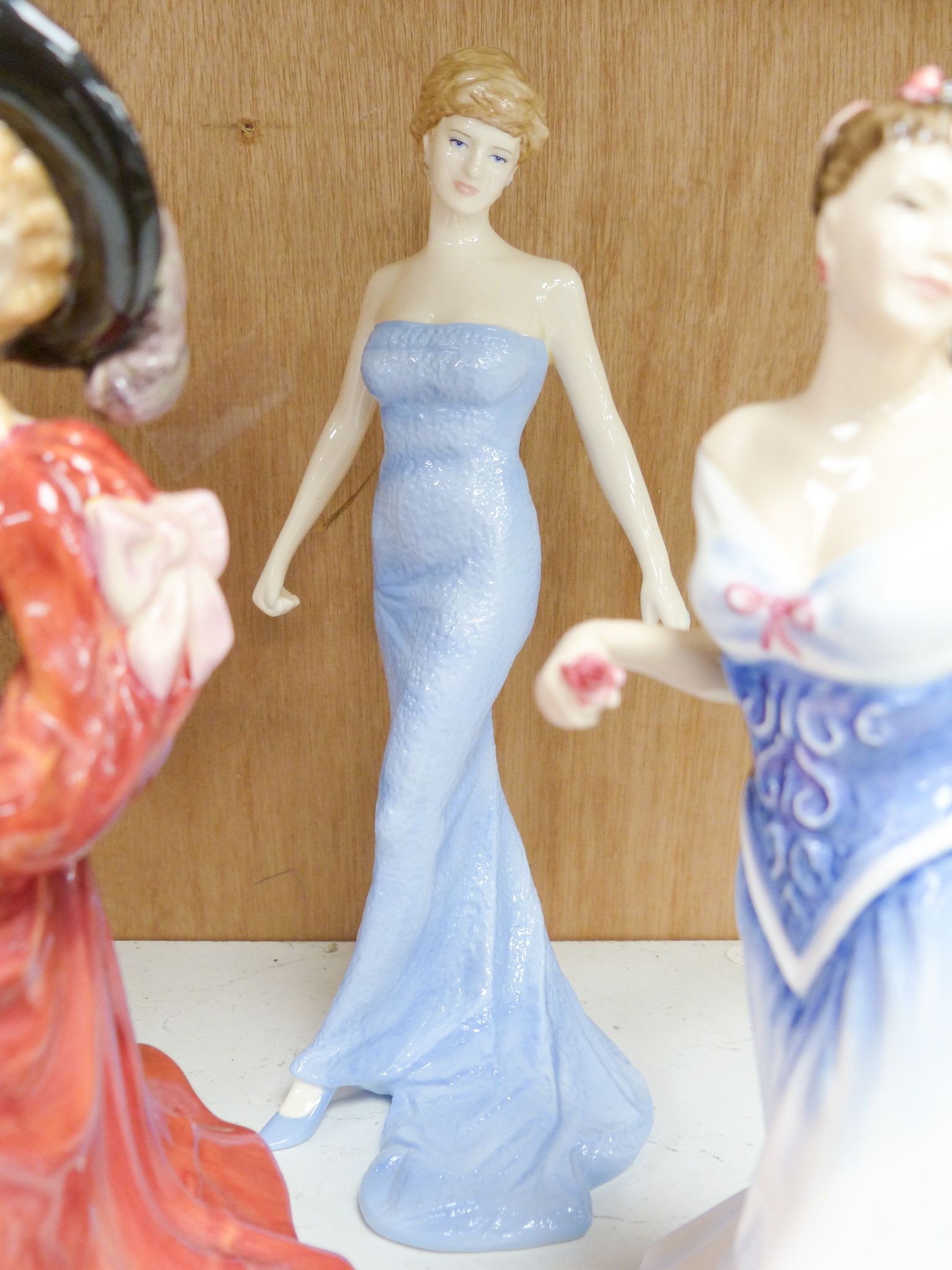 Seven Royal Doulton figurines: Carrie HN2800, Jacqueline HN2000, For You HN3754, Diana Princess of Wales HN5061, Belle HN3703, Patricia HN3365, Paisley Shawl HN1987